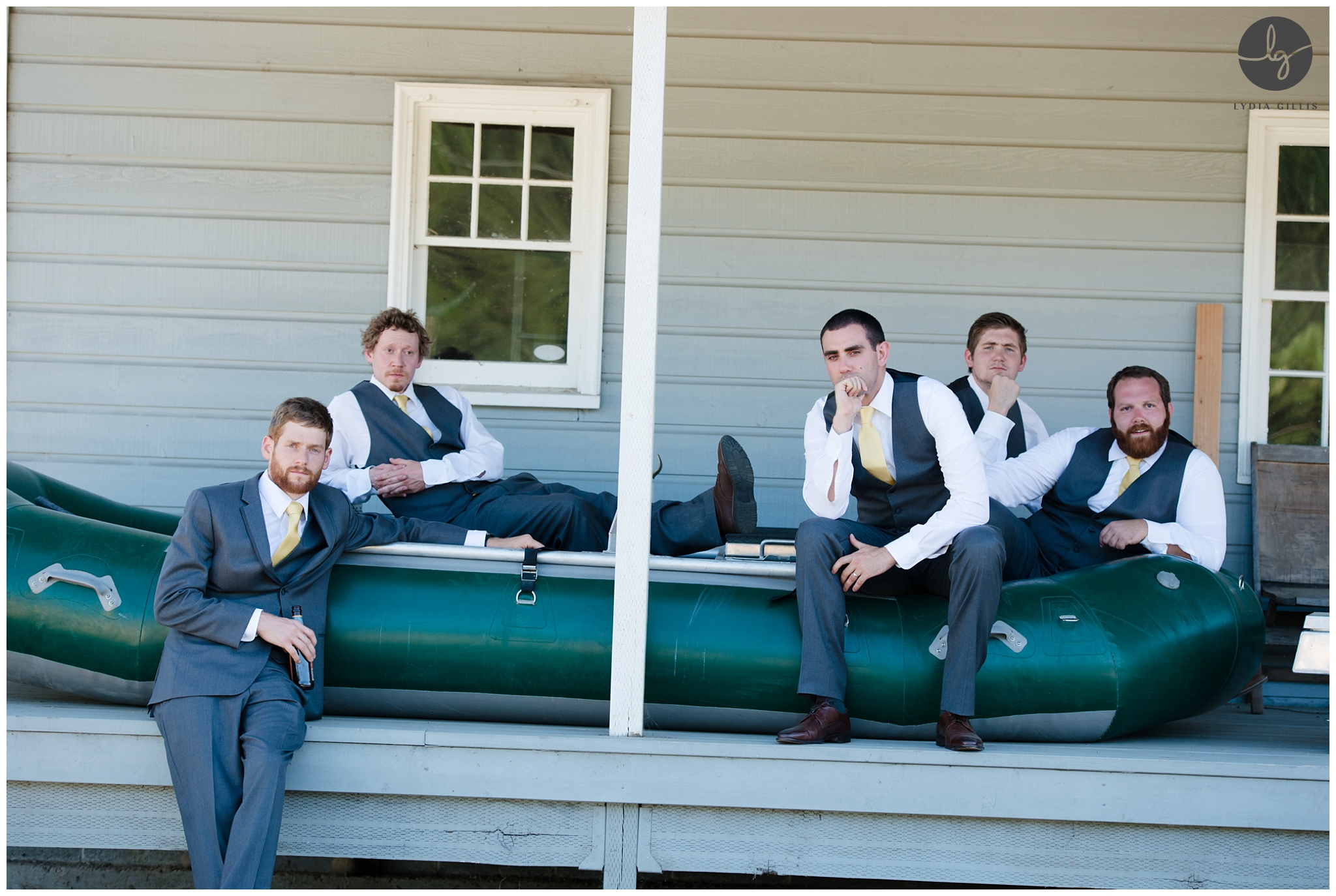 outdoor wedding, picture of wedding party sitting on a boat | Lydia Gillis Photography