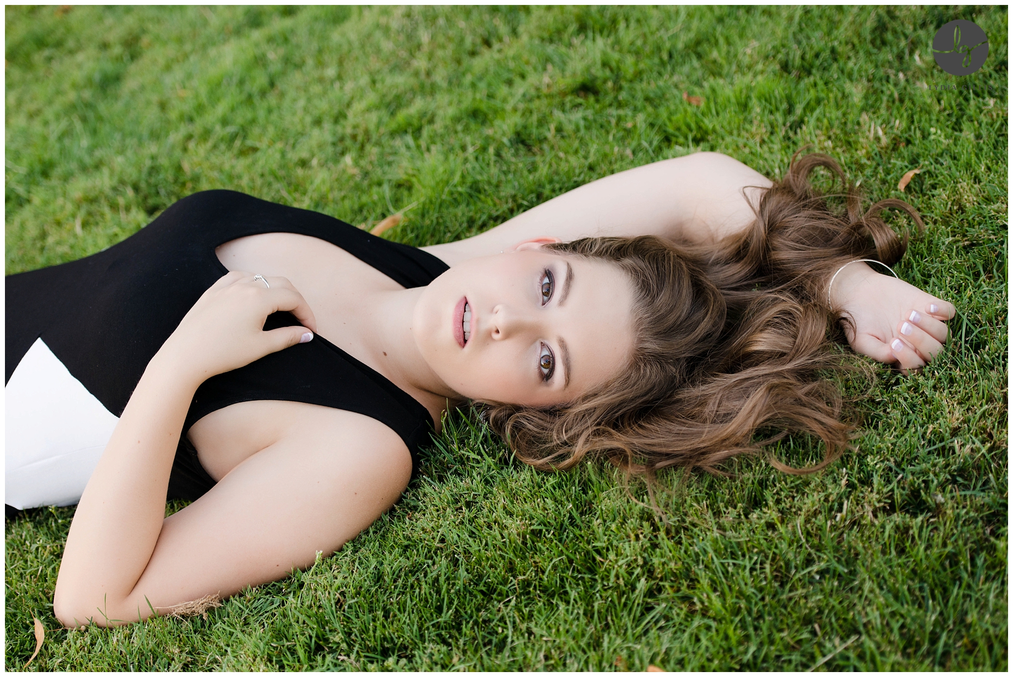 Picture of a senior girl laying down on the grass photographed by eugene senior photographer | Lydia Gillis Photography 