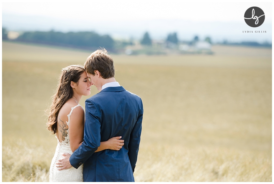 Oregon back yard wedding. Picture of bride and groom. on a grass field